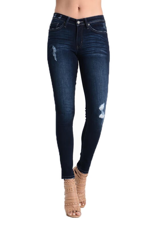 These dark wash lightly distressed denim skinny jeans feature a subtle distressing and made from the perfect blend of denim.  These women's mid rise jeans have the perfect amount of stretch and hug your body in all the right places. Priced at $49.50.