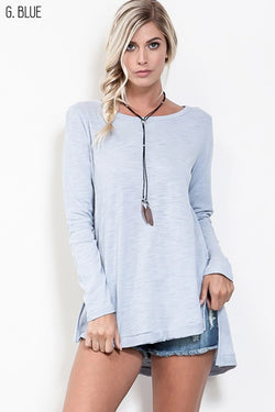 Raw edge cotton long sleeve top with high-low hem.  Available in blush and light blue.  Priced at $36.50.