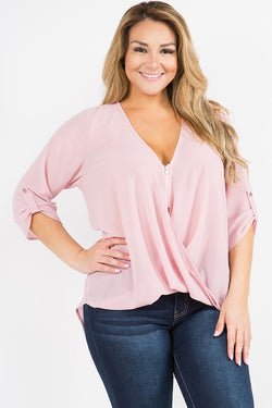 Soft pink chiffon blouse featuring a surplice zip front neckline, 3/4 sleeves with button tie backs,  pleated front hem, and longer straight hem in the back.  Priced at $42.00.