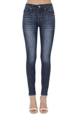 These Denim Skinnys are a must have! They are brought to us by Kancan and they come in a dark color. These jeans feature the five pocket style, a button and zipper for closure, whiskers, light fading and no destroy. On the back they are plain and at the bottom they are skinny. These jeans would look great with heels or sneakers!  Priced $49.95.