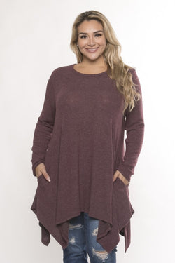 So soft you won't want to take it off.  Stylish brushed knit handkerchief hem long sleeve top with pockets.  Pair with leggings or jeans.  Priced at $45.00.